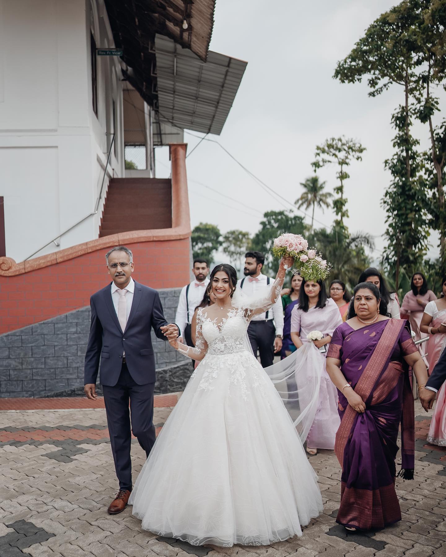 Bride arriving with family and friends