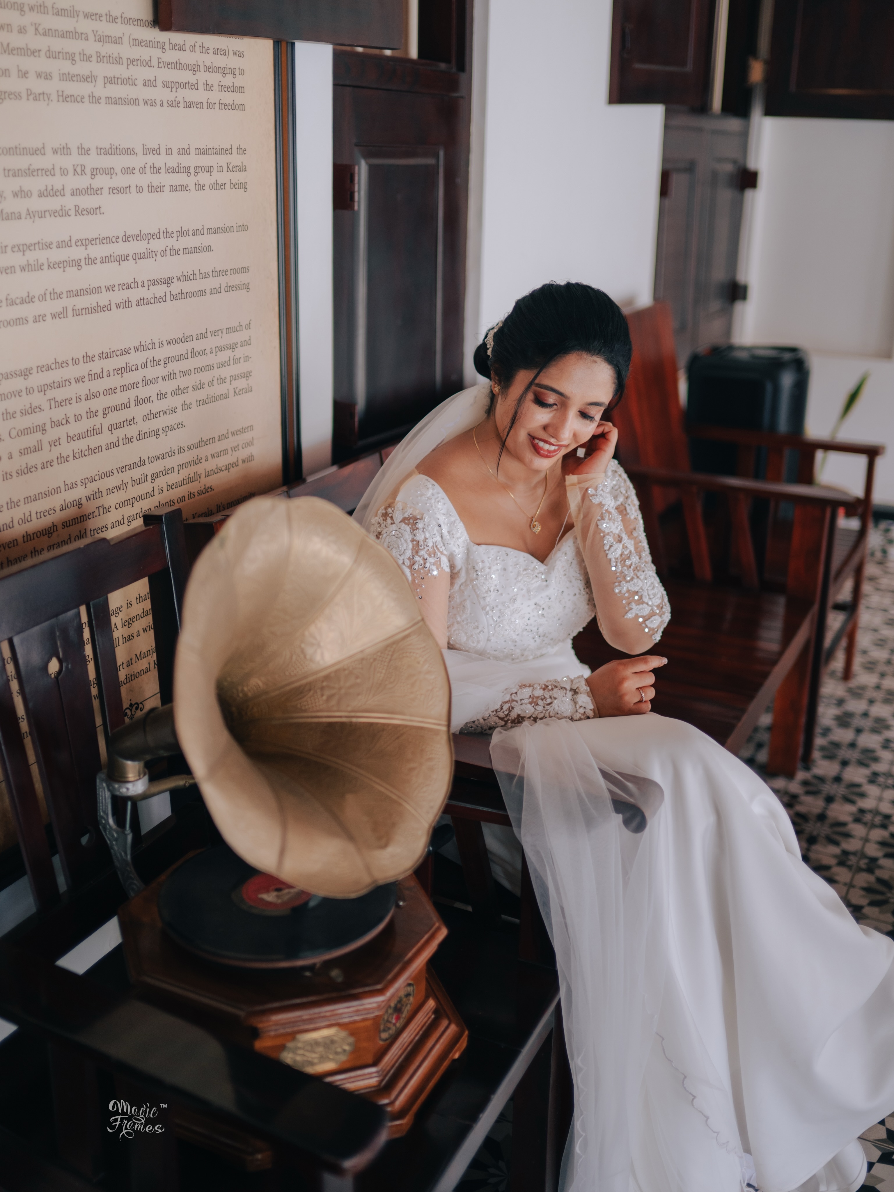 Bride seated beside a vintage gramophone