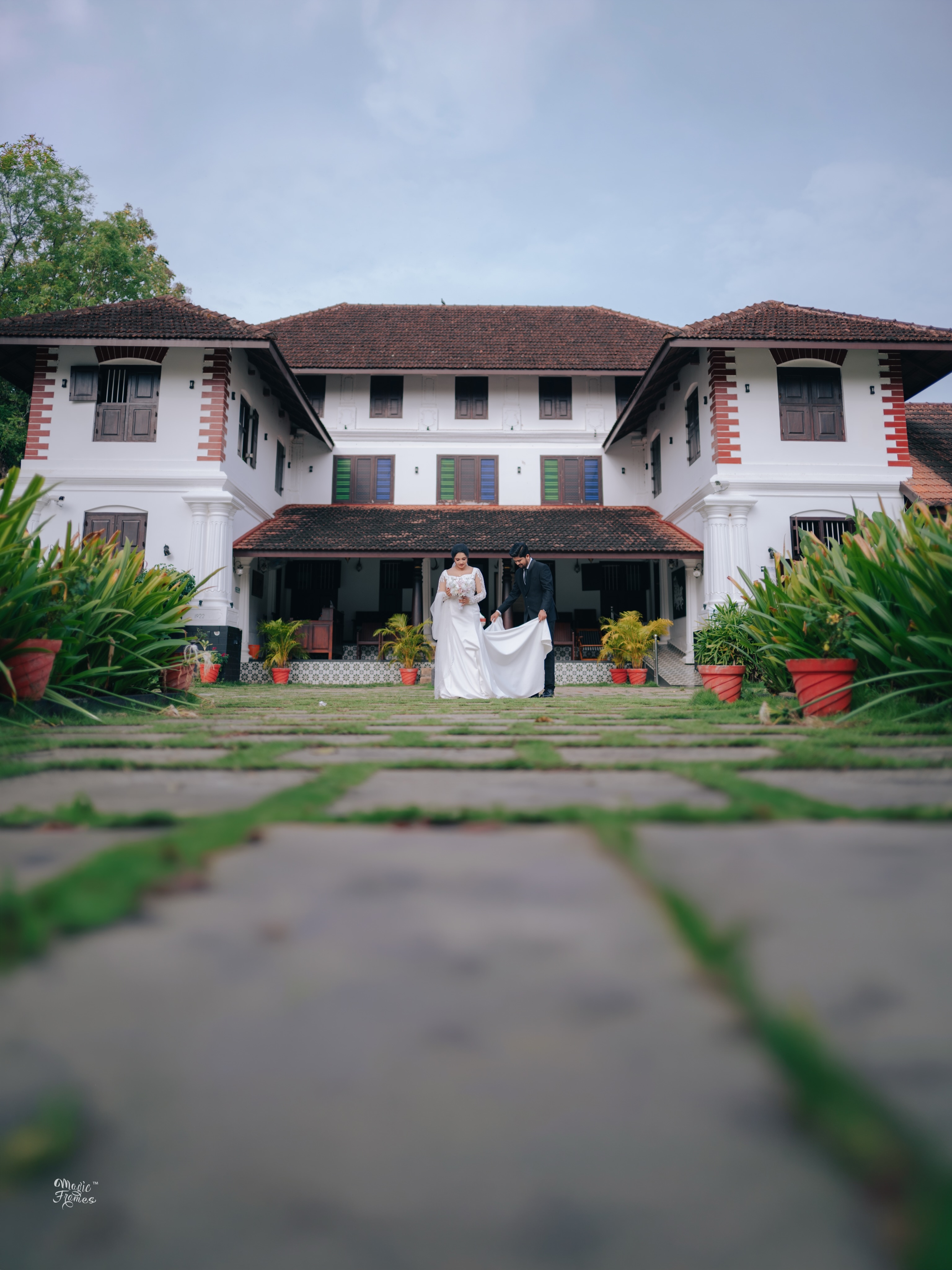 Wedding couple outside a heritage home